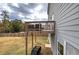 A wooden deck overlooks a spacious, fenced backyard with ample room for outdoor activities and gatherings at 419 Murphy Ave, Canton, GA 30114