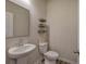 Small powder room with pedestal sink and updated fixtures at 419 Murphy Ave, Canton, GA 30114