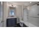 Modern bathroom with gray vanity, frameless shower, and hexagon tile floor at 419 Murphy Ave, Canton, GA 30114