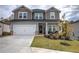 Two-story home with front porch and two-car garage at 419 Murphy Ave, Canton, GA 30114