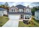 Two-story house with gray siding, a double garage, and a welcoming porch at 419 Murphy Ave, Canton, GA 30114