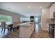 Open concept kitchen with island and view into adjacent living room at 419 Murphy Ave, Canton, GA 30114