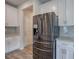 Stainless steel refrigerator in kitchen with white cabinets at 419 Murphy Ave, Canton, GA 30114