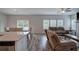 Open living room with hardwood floors and a view from the kitchen at 419 Murphy Ave, Canton, GA 30114