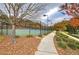 Tennis courts surrounded by trees and landscaping at 419 Murphy Ave, Canton, GA 30114