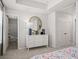 Bedroom with white dresser and ensuite bathroom at 216 Wilder Ridge Way, Lawrenceville, GA 30044