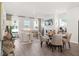 Open concept dining area with seating for four, adjacent to a spacious living room at 216 Wilder Ridge Way, Lawrenceville, GA 30044