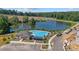 Community pool with lake view and cabana at 216 Wilder Ridge Way, Lawrenceville, GA 30044