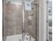 Modern shower with glass enclosure and neutral tile at 216 Wilder Ridge Way, Lawrenceville, GA 30044