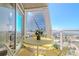 Balcony with yellow table and chairs, offering stunning city views at 3325 Piedmont Ne Rd # 2904, Atlanta, GA 30305