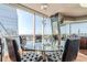 Modern dining area with a glass table and city views at 3325 Piedmont Ne Rd # 2904, Atlanta, GA 30305