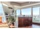 Home wet bar with wood cabinetry and city views at 3325 Piedmont Ne Rd # 2904, Atlanta, GA 30305