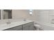 Bathroom boasts double sinks and a bathtub at 13958 Conrad Court Ln, Covington, GA 30014