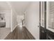 Long hallway with wood-look flooring at 13958 Conrad Court Ln, Covington, GA 30014