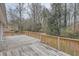 Wooden deck overlooking a wooded backyard with privacy at 2374 Rolling Acres Sw Dr, Conyers, GA 30094