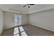 Main bedroom with carpeted floor, ceiling fan, and large window at 3131 Ramblewood Ct, Powder Springs, GA 30127