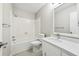 Clean bathroom with white tile and quartz countertop at 680 Branch Valley Ct, Roswell, GA 30076