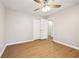 Well-lit bedroom with ceiling fan and wood-look floors at 680 Branch Valley Ct, Roswell, GA 30076