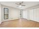 Bright bedroom featuring hardwood floors and ample closet space at 680 Branch Valley Ct, Roswell, GA 30076