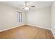 Spacious bedroom featuring light walls and wood-look floors at 680 Branch Valley Ct, Roswell, GA 30076