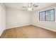 Bedroom with ceiling fan and large window at 680 Branch Valley Ct, Roswell, GA 30076