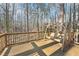 Spacious deck with swing overlooking wooded area at 680 Branch Valley Ct, Roswell, GA 30076