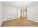 Dining room featuring hardwood floors and chandelier at 680 Branch Valley Ct, Roswell, GA 30076