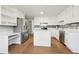 Updated kitchen with white cabinets, an island, and stainless steel appliances at 680 Branch Valley Ct, Roswell, GA 30076