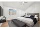 Main bedroom with wood floors, a large window, and a stylish bed at 680 Branch Valley Ct, Roswell, GA 30076