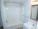 Clean bathroom with a shower/tub combo, vanity, and a framed mirror at 100 Meadow Lake Dr, Carrollton, GA 30116