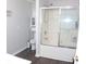 Bathroom with shower/tub combo and dark flooring at 100 Meadow Lake Dr, Carrollton, GA 30116