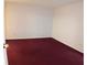 Simple bedroom with maroon carpeting and neutral walls at 100 Meadow Lake Dr, Carrollton, GA 30116