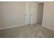 Bedroom with gray carpet and double doors at 100 Meadow Lake Dr, Carrollton, GA 30116