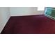 Empty bedroom with maroon carpeting and neutral walls at 100 Meadow Lake Dr, Carrollton, GA 30116