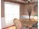 Formal dining room with hardwood floors and window blinds at 100 Meadow Lake Dr, Carrollton, GA 30116