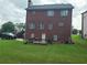 Brick house with a deck and a large backyard at 100 Meadow Lake Dr, Carrollton, GA 30116