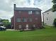 Brick house with a deck and a large backyard at 100 Meadow Lake Dr, Carrollton, GA 30116