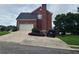 Brick house with a two-car garage and a spacious driveway at 100 Meadow Lake Dr, Carrollton, GA 30116
