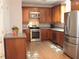 Kitchen with stainless steel appliances and wood cabinets at 100 Meadow Lake Dr, Carrollton, GA 30116