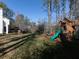 Large backyard with playground and grassy lawn at 107 Vestry Walk, Douglasville, GA 30134