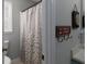 Small bathroom with shower and a window for natural light at 107 Vestry Walk, Douglasville, GA 30134