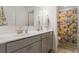 Bathroom with double vanity and floral shower curtain at 1180 Trident Maple Chase, Lawrenceville, GA 30045