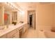 Double vanity bathroom with soaking tub and walk-in closet at 289 Regent Sq, Woodstock, GA 30188