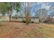 House exterior view, showcasing backyard and trees at 4059 Big Valley Trl, Stone Mountain, GA 30083