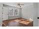 Bright bedroom with hardwood floors and two windows at 4428 Grove Field Park, Suwanee, GA 30024