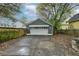 Detached two-car garage with a gray exterior and long driveway at 107 Howard Ne St, Atlanta, GA 30317