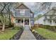 Two-story craftsman home with a charming front porch and well-manicured landscaping at 107 Howard Ne St, Atlanta, GA 30317