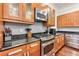 Kitchen features gas cooktop, granite counters, and wood cabinets at 107 Howard Ne St, Atlanta, GA 30317