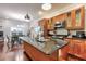 Modern kitchen with wood cabinets, granite countertops, and island at 107 Howard Ne St, Atlanta, GA 30317