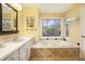 Main bathroom with soaking tub and double vanity at 1883 Acuba Ln, Atlanta, GA 30345